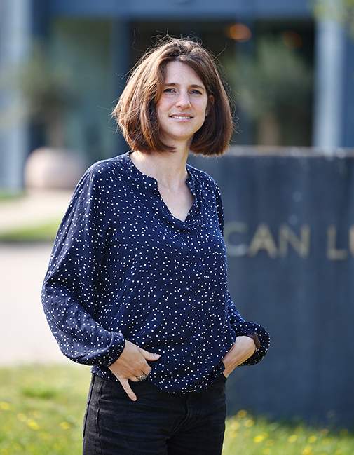 ESG manager in front of Scanlux Packaging headquarters