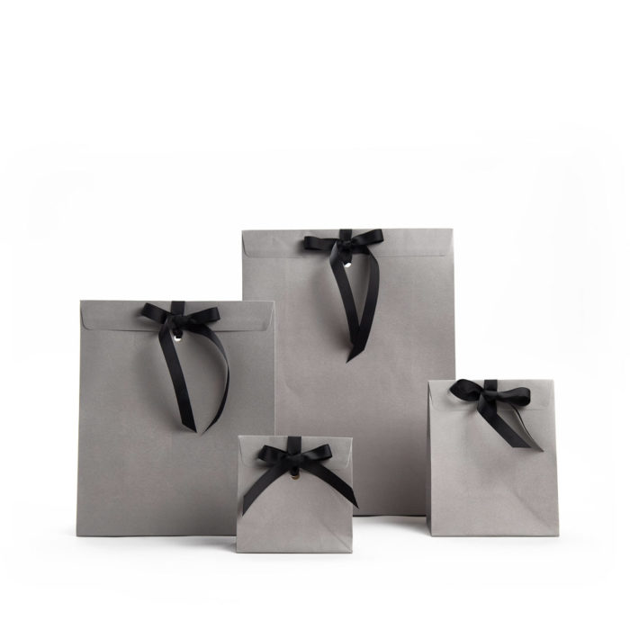 Image of: Gift bag matt grey. Embossed w. selfadhes closure and hole for ribbon. FSC®. REMEMBER RIBBON IS NOT INCLUDED